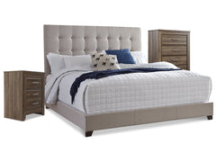 J&M Furniture - Ashley Furniture - Dolante Queen Upholstered Bed with Chest of Drawers and Nightstand - Queen Upholstered Bed with Chest of Drawers and Nightstand - B130B7