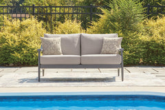 J&M Furniture - Ashley Furniture - Ocean Beach Outdoor Loveseat with Cushion - Loveseat w/Cushion - PCP510-835