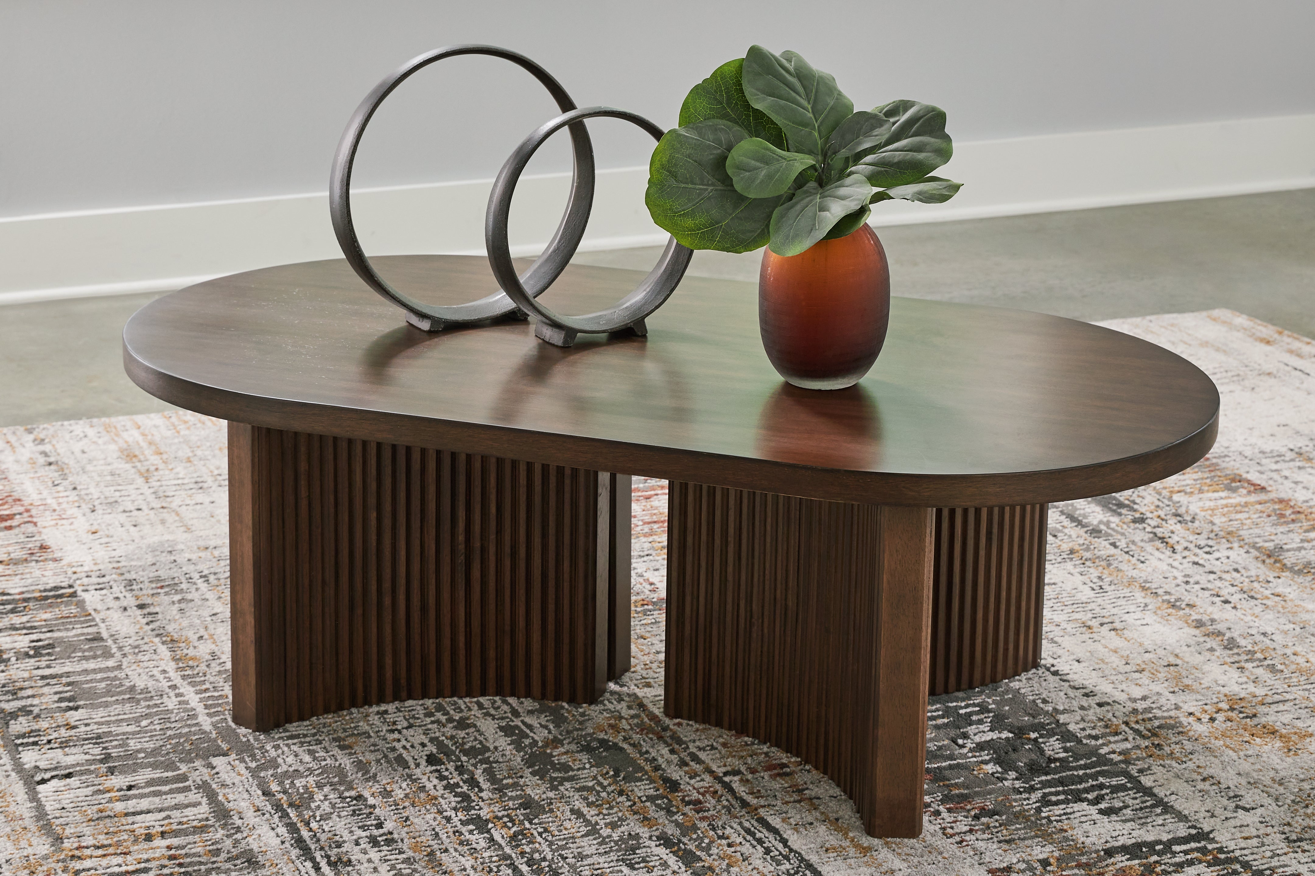 J&M Furniture - Ashley Furniture - Korestone Coffee Table - Oval Cocktail Table - T689-0