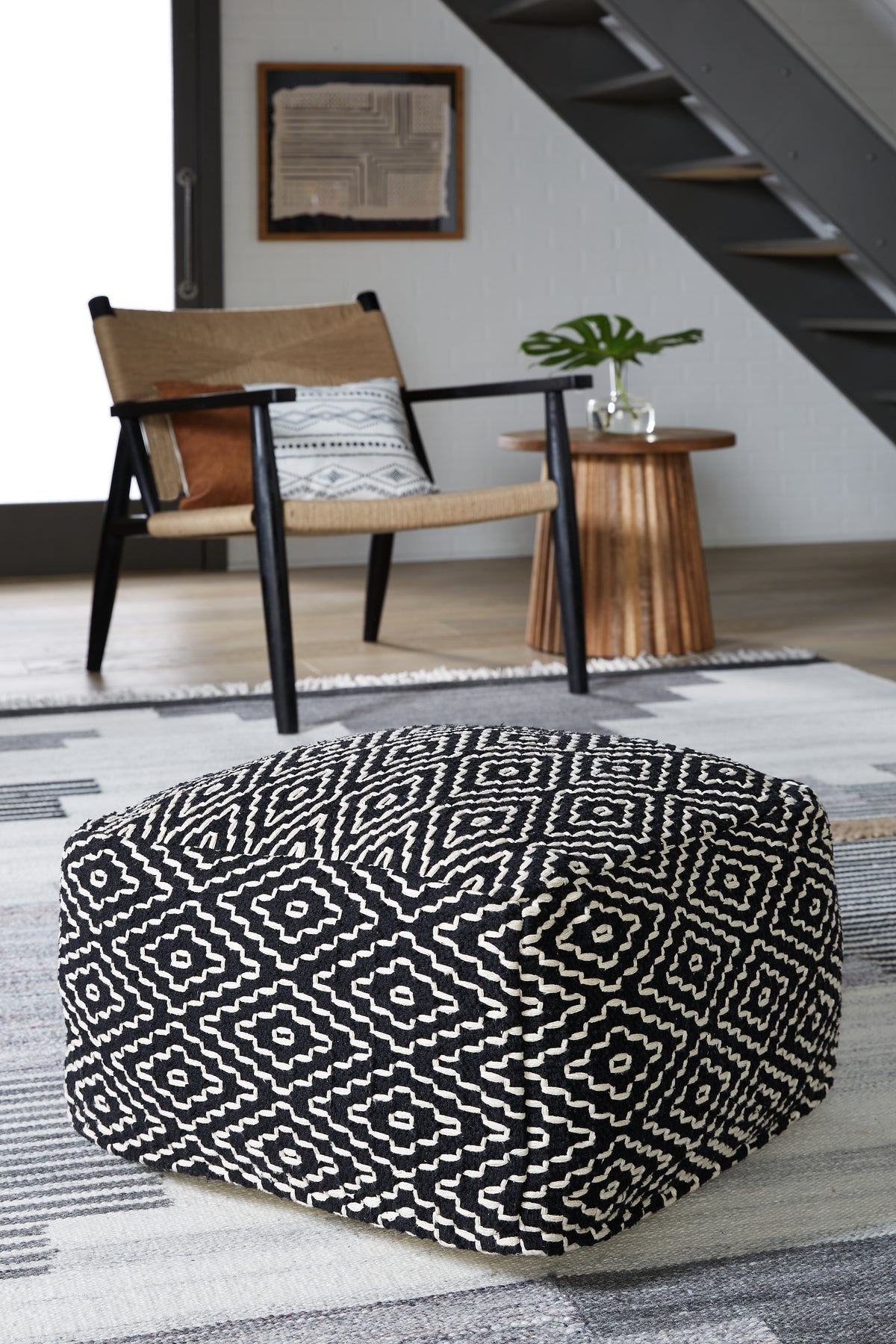 J&M Furniture - Ashley Furniture - Jasett Pouf - Pouf / Black/Ivory - A1001058