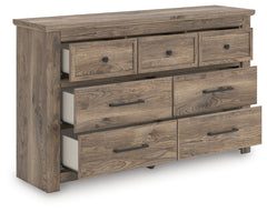 J&M Furniture - Ashley Furniture - Rusticott Dresser - Seven Drawer Dresser / Brown - PCB2260-31