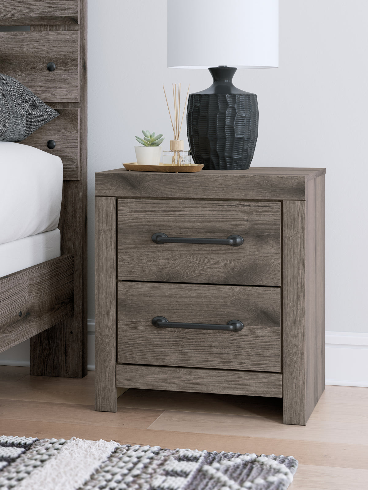 J&M Furniture - Ashley Furniture - Graystorm Nightstand - Two Drawer Night Stand / Brown Gray - PCB2405-92