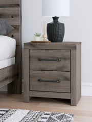 J&M Furniture - Ashley Furniture - Graystorm Nightstand - Two Drawer Night Stand / Brown Gray - PCB2405-92