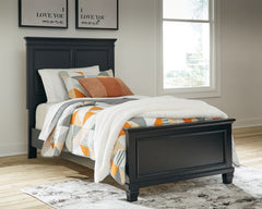 J&M Furniture - Ashley Furniture - Lanolee Twin Panel Bed - Twin Panel Bed / Black - B687B2