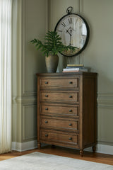 J&M Furniture - Ashley Furniture - Sturlayne Chest of Drawers - Five Drawer Chest / Brown - B787-46