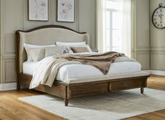 J&M Furniture - Ashley Furniture - Sturlayne King Upholstered Panel Bed - King Upholstered Panel Bed / Brown - B787B4