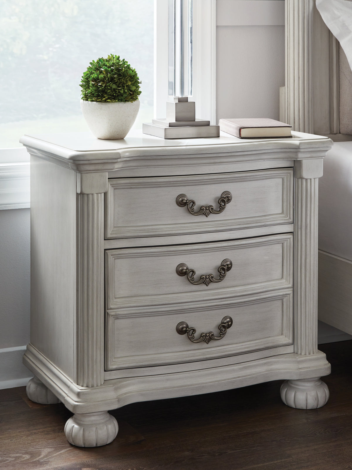J&M Furniture - Ashley Furniture - Montelaine Nightstand - Three Drawer Night Stand / Antique White - B795-93