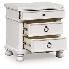 J&M Furniture - Ashley Furniture - Rowlenstown Nightstand - Three Drawer Night Stand / Brown - PCB824-93