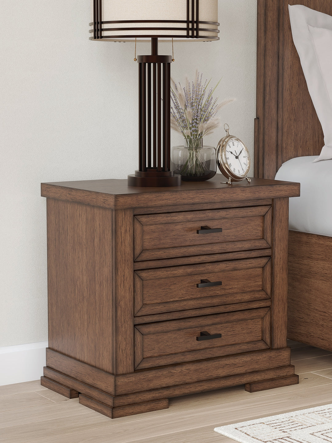 J&M Furniture - Ashley Furniture - Taffenbrook Nightstand - Three Drawer Night Stand / Medium Brown - B849-93