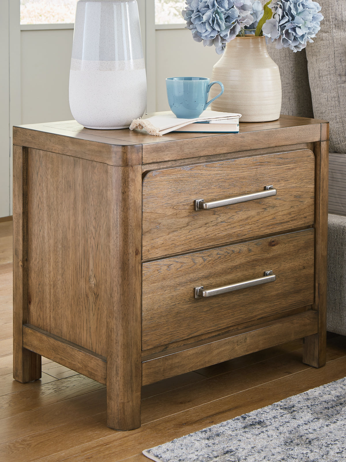 J&M Furniture - Ashley Furniture - Cabalynn Nightstand - Two Drawer Night Stand / Light Brown - B974-92