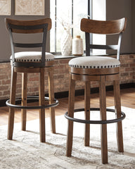 J&M Furniture - Ashley Furniture - Valebeck Bar Height Bar Stool - Tall UPH Swivel Barstool(1/CN) / Black - D546-630