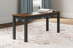 J&M Furniture - Ashley Furniture - Owingsville Dining Bench - Large Dining Room Bench / Black/Brown / 42"W x 14"D x 18"H - D580-00