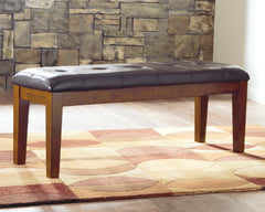 J&M Furniture - Ashley Furniture - Ralene Dining Bench - Large UPH Dining Room Bench / Medium Brown / 50"W x 16"D x 19"H - D594-00