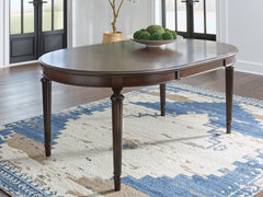 J&M Furniture - Ashley Furniture - Lavinton Dining Extension Table - Oval Dining Room EXT Table / Brown - D764-35
