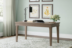 J&M Furniture - Ashley Furniture - Janismore 63" Home Office Desk - Home Office Desk / Weathered Gray - H776-44