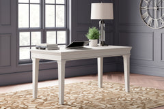 J&M Furniture - Ashley Furniture - Kanwyn Home Office Desk - Home Office Desk / Whitewash - H777-44