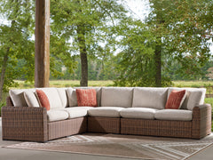 J&M Furniture - Ashley Furniture - Dolan Creek 4-Piece Outdoor Sectional - 4-Piece Outdoor Sectional / Beige/Brown - PCP610P2