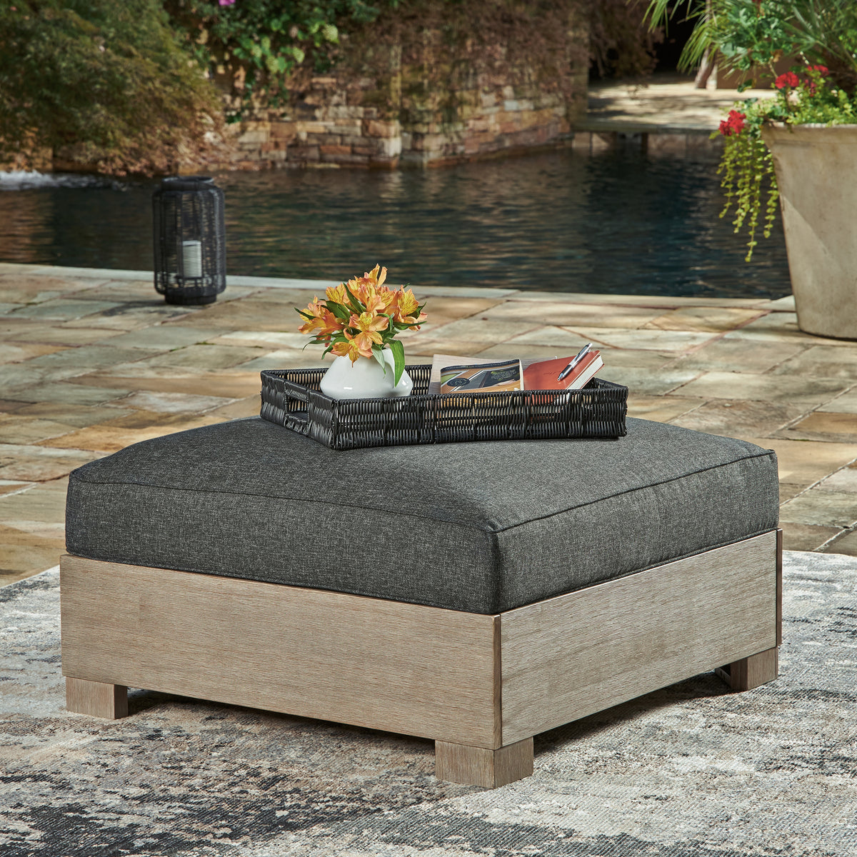 J&M Furniture - Ashley Furniture - Citrine Park Outdoor Ottoman with Cushion - Ottoman with Cushion / Brown/Charcoal - P660-814