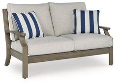 J&M Furniture - Ashley Furniture - Rainier Ranch Outdoor Loveseat with Cushion - Loveseat w/Cushion / Brown/Beige - P701-835