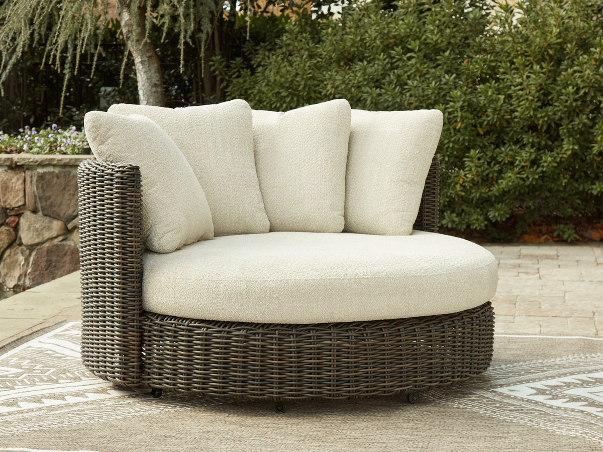 J&M Furniture - Ashley Furniture - Kimora Outdoor Swivel Lounge Chair with Cushion - Swivel Lounge Chair w/Cushion / Beige/Dark Brown - P711-810