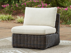 J&M Furniture - Ashley Furniture - Kimora Outdoor Armless Chair with Cushion - Armless Chair w/Cushion / Beige/Dark Brown - P711-846