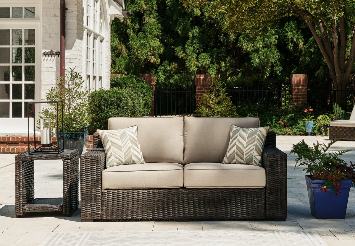J&M Furniture - Ashley Furniture - Coastline Bay Outdoor Loveseat with Cushion - Loveseat w/Cushion / Brown - P784-835