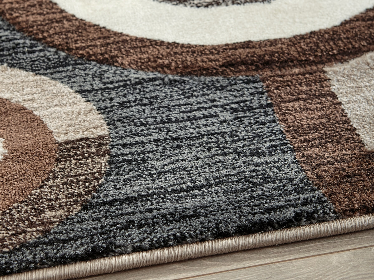 J&M Furniture - Ashley Furniture - Guintte 5' x 6'7" Rug - 5' x 6'7" Rug / Multi - R403972