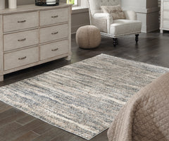 J&M Furniture - Ashley Furniture - Gizela 5'3" x 7'3" Rug - 5'3" x 7'3" Rug / Ivory/Beige/Gray - R404862