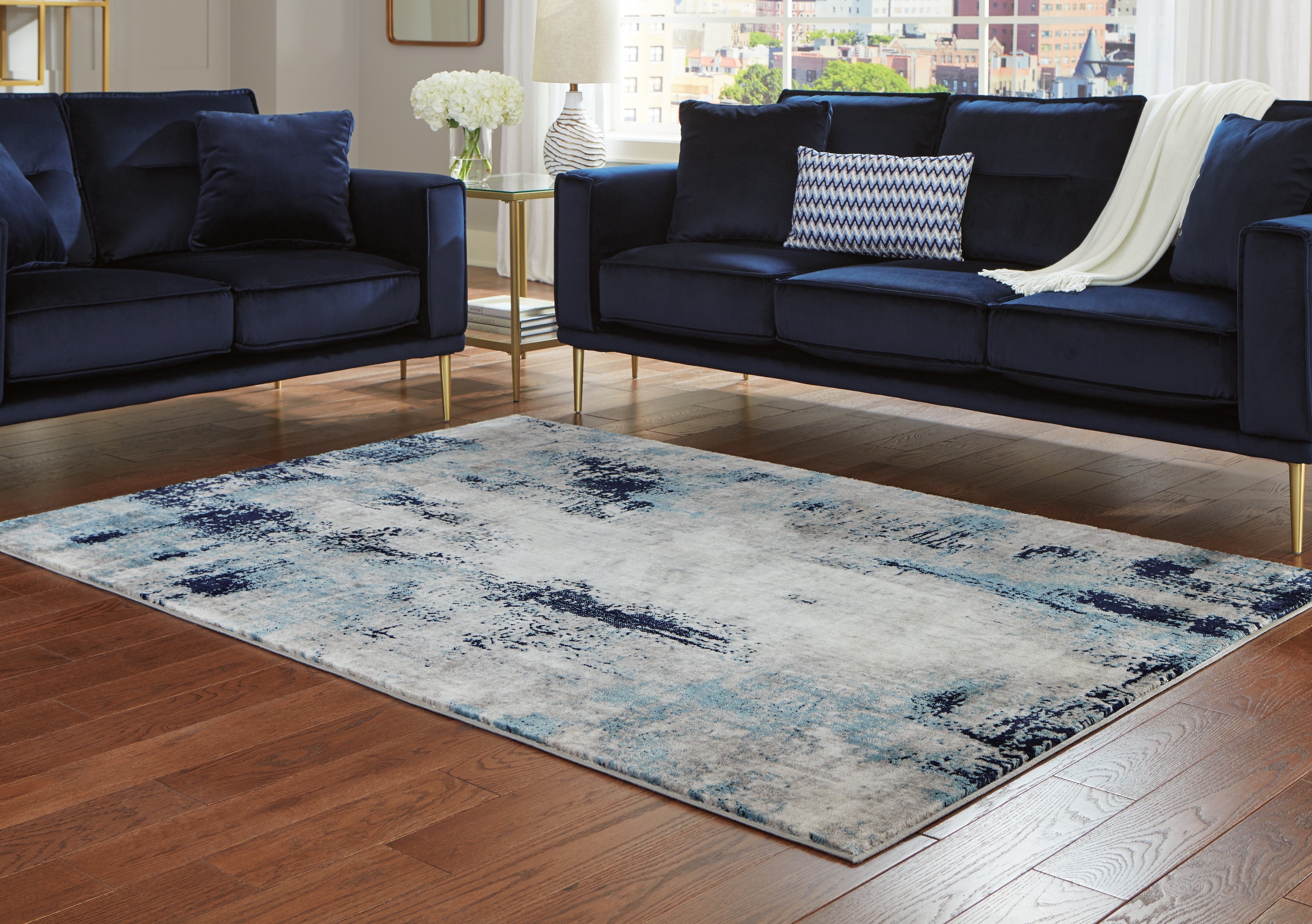 J&M Furniture - Ashley Furniture - Leonelle 5'3" x 7'3" Rug - 5'3" x 7'3" Rug / Cream/Blue/Gray - R404872