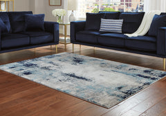 J&M Furniture - Ashley Furniture - Leonelle 5'3" x 7'3" Rug - 5'3" x 7'3" Rug / Cream/Blue/Gray - R404872