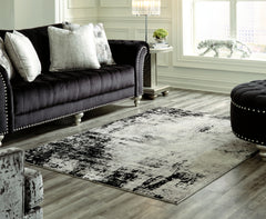 J&M Furniture - Ashley Furniture - Zekeman 7'10" x 10' Rug - 7'10" x 10' Rug / Black/Cream/Gray - R404921