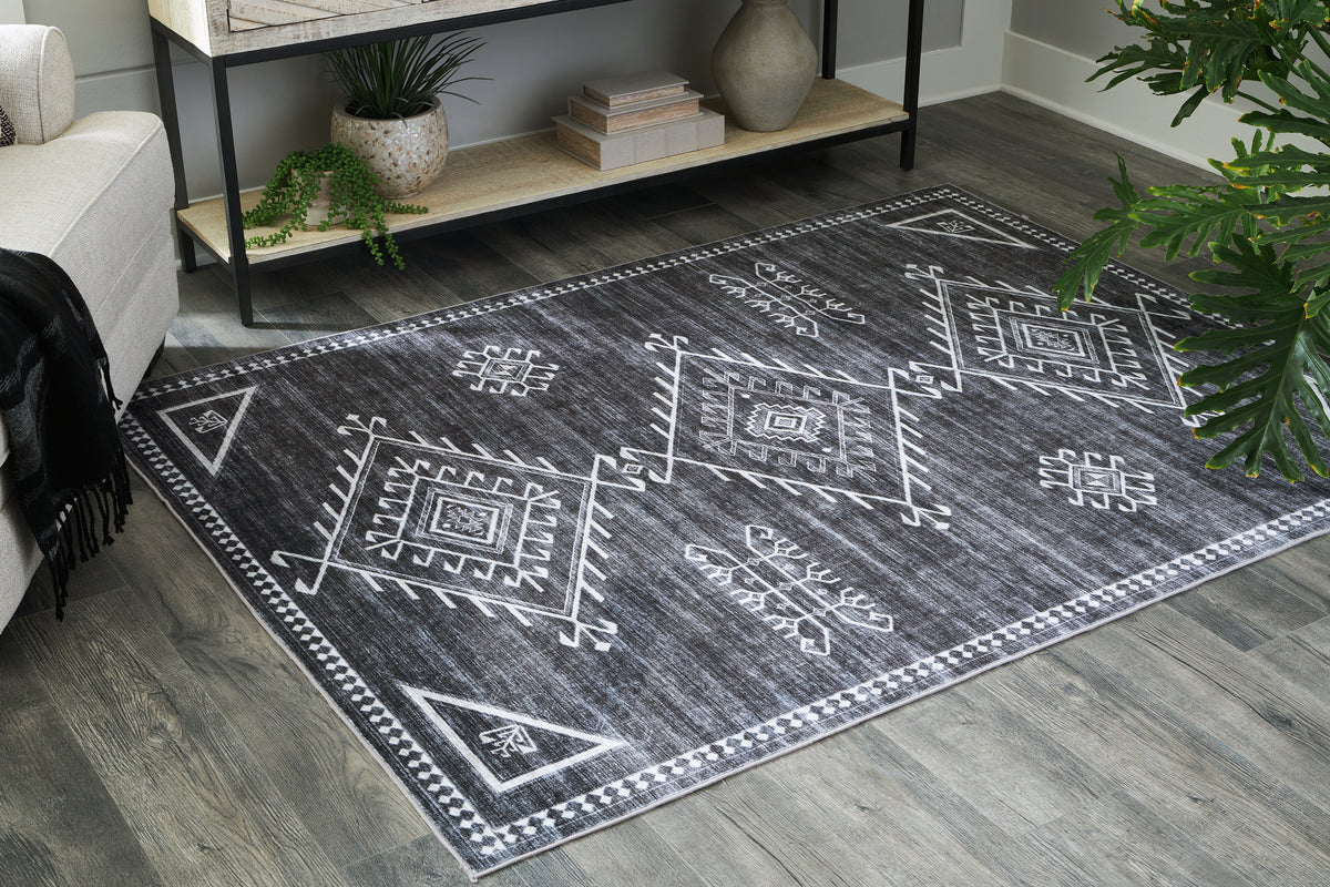 J&M Furniture - Ashley Furniture - Arloman 5' x 7' Washable Rug - 5' x 7' Washable Rug / Black/Cream/Gray - R405932