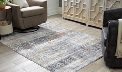 J&M Furniture - Ashley Furniture - Rhettner 5'3" x 7'3" Rug - 5'3" x 7'3" Rug / Multi - R406072