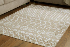 J&M Furniture - Ashley Furniture - Bunchly 4'11" x 7'2" Washable Rug - 4'11" x 7'2" Washable Rug / Tan/Brown/Cream - R406222