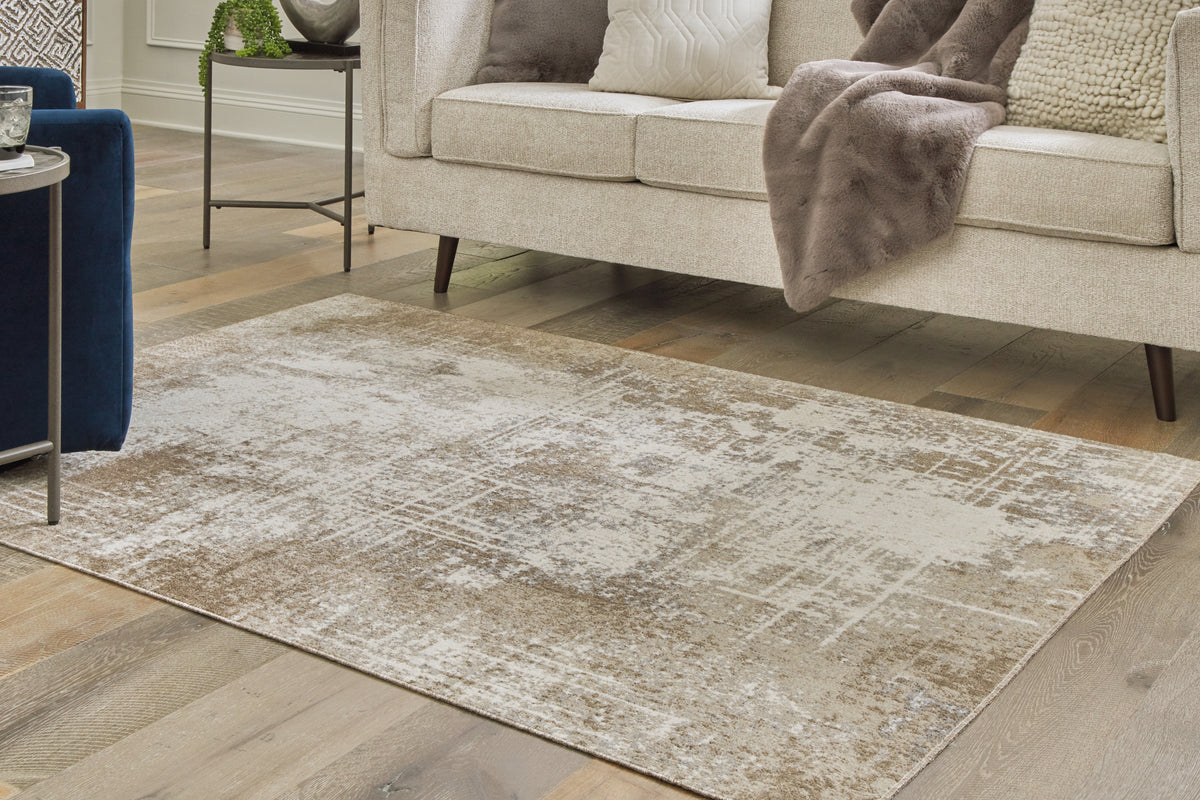 J&M Furniture - Ashley Furniture - Grifflain 5'1" x 7' Washable Rug - 5'1" x 7' Washable Rug / Tan/Brown/Gray - R406232