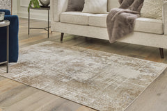 J&M Furniture - Ashley Furniture - Grifflain 5'1" x 7' Washable Rug - 5'1" x 7' Washable Rug / Tan/Brown/Gray - R406232