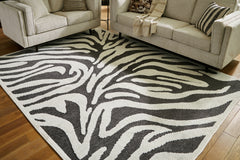 J&M Furniture - Ashley Furniture - Thomwith 8' x 10'2" Washable Rug - 8' x 10'2" Washable Rug / Black/Ivory - R406291