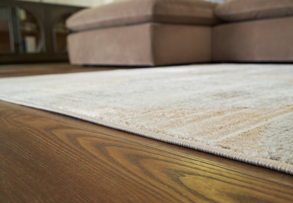 J&M Furniture - Ashley Furniture - Truward 8' x 10' Rug - 8' x 10' Rug / Linen/Gray/Caramel - R406471