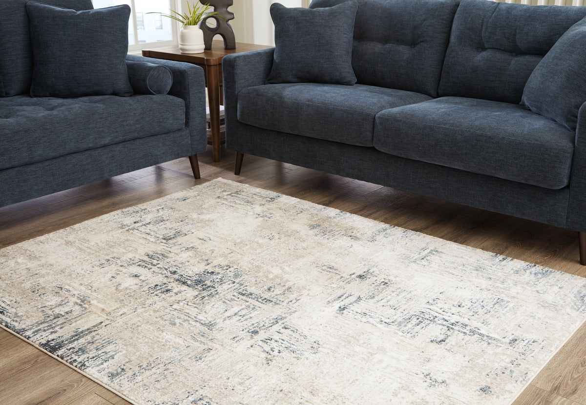 J&M Furniture - Ashley Furniture - Gentor 5' x 7' Rug - 5' x 7' Rug / Blue/Ivory - R406522