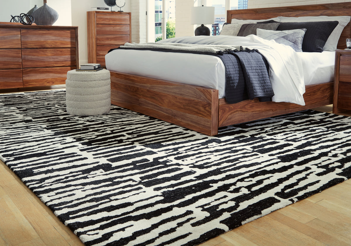 J&M Furniture - Ashley Furniture - Bramshaw 10' x 14' Rug - 10' x 14' Rug / Black/Ivory - R406760
