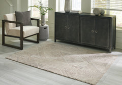 J&M Furniture - Ashley Furniture - Jadott 5' x 7' Rug - 5' x 7' Rug / Beige/Brown - R406802