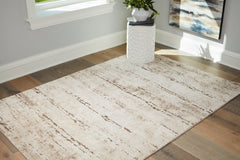 J&M Furniture - Ashley Furniture - Kasney 5' x 7' Rug - 5' x 7' Rug / Cream/Brown - R406852