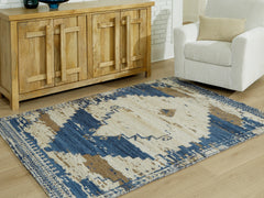 J&M Furniture - Ashley Furniture - Varnler 8' x 10' Rug - 8' x 10' Rug / Blue/Brown/Tan - R407131