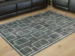 J&M Furniture - Ashley Furniture - Elderland Washable 5' x 7' Area Rug - Washable 5' x 7' Area Rug / Black/Gray - R407402