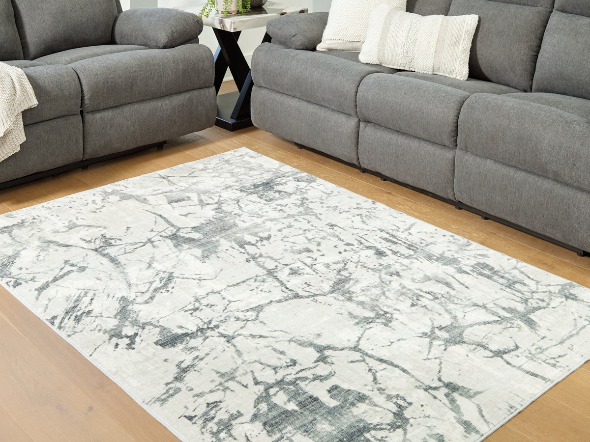 J&M Furniture - Ashley Furniture - Tobinbury Washable 5' x 7' Area Rug - Washable 5' x 7' Area Rug / Gray - R407422