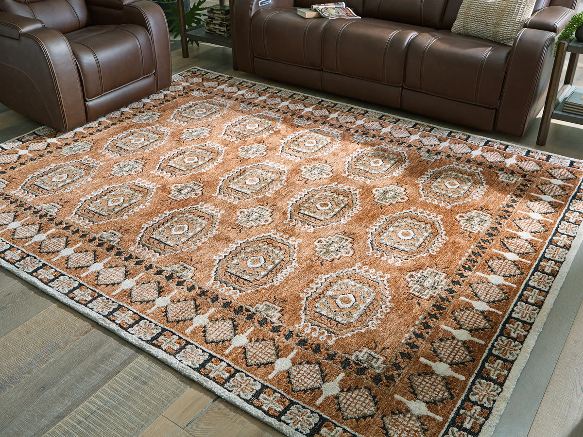 J&M Furniture - Ashley Furniture - Qaabiz 7'8" x 10' Area Rug - 7'8" x 10' Area Rug / Sienna/Ivory/Black - R407521