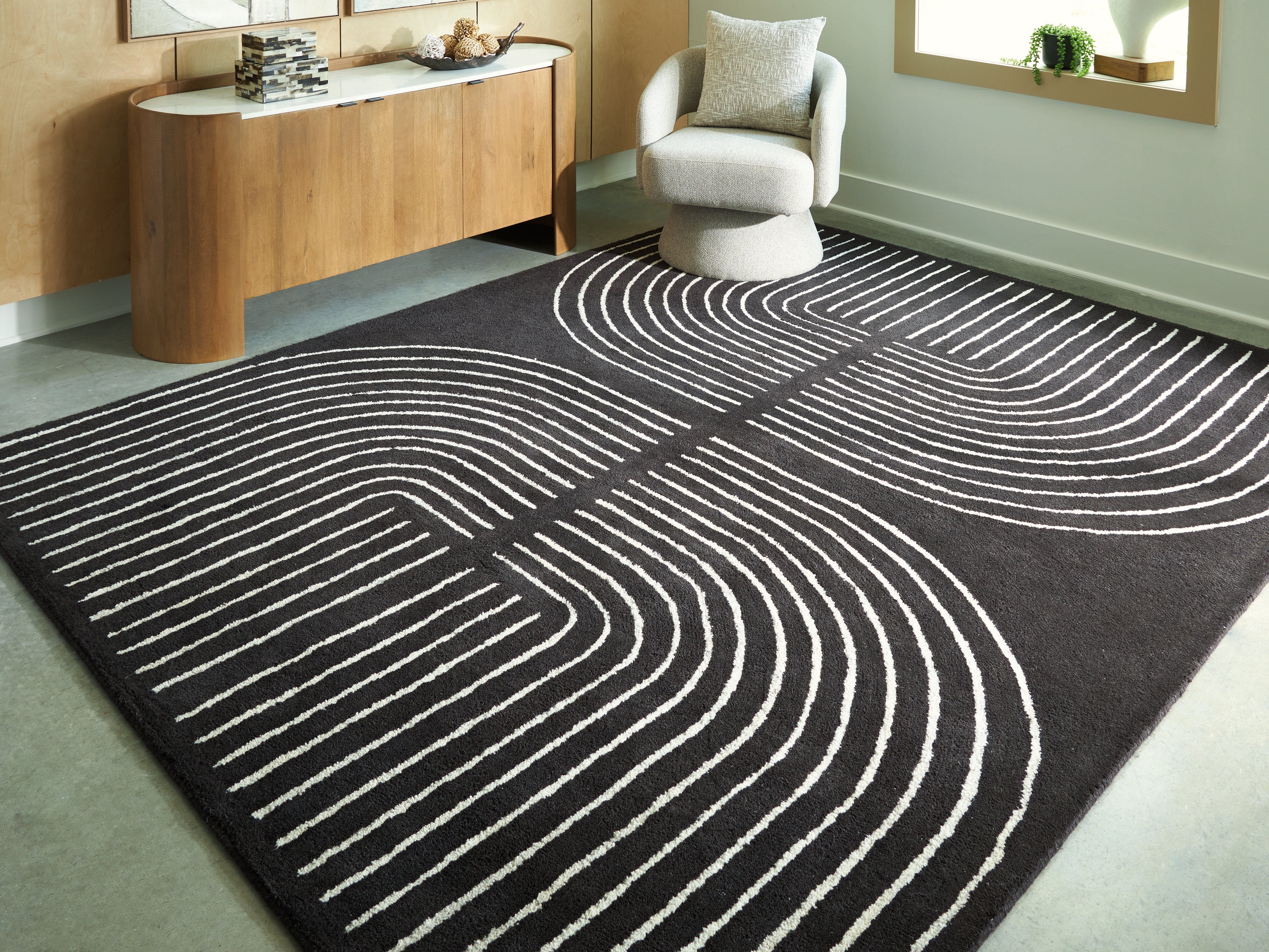 J&M Furniture - Ashley Furniture - Eldonmore 7'8" x 10' Area Rug - 7'8" x 10' Area Rug / Black/Ivory - R407571