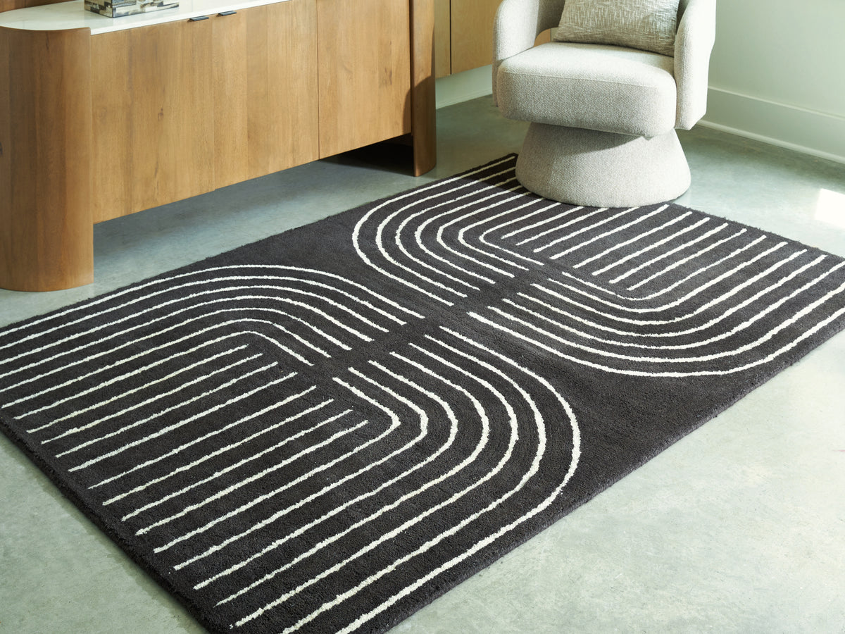 J&M Furniture - Ashley Furniture - Eldonmore 5' x 7' Area Rug - 5' x 7' Area Rug / Black/Ivory - R407572