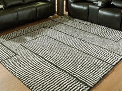 J&M Furniture - Ashley Furniture - Kurtmen 7'10" x 9'10" Area Rug - 7'10" x 9'10" Area Rug / Black/Ivory - R407591