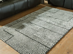 J&M Furniture - Ashley Furniture - Kurtmen 5' x 7' Area Rug - 5' x 7' Area Rug / Black/Ivory - R407592
